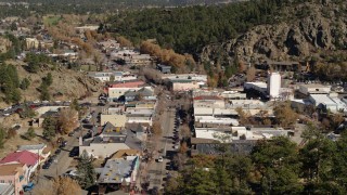 DX0001_001992 - 5.7K aerial stock footage a reverse view of shops on road through Estes Park, Colorado
