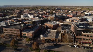 DX0001_002009 - 5.7K aerial stock footage of approaching brick office buildings and shops in Fort Collins, Colorado