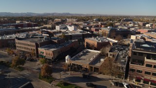 DX0001_002016 - 5.7K aerial stock footage pass a row of brick office buildings and shops in Fort Collins, Colorado