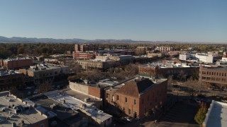 DX0001_002028 - 5.7K aerial stock footage of an approach to shops and office buildings in Fort Collins, Colorado