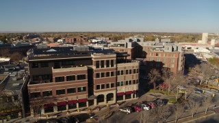 DX0001_002030 - 5.7K aerial stock footage of a brick office building in Fort Collins, Colorado