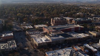 DX0001_002037 - 5.7K aerial stock footage of a view of office buildings, shops, parking garage in Fort Collins, Colorado
