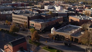 DX0001_002041 - 5.7K aerial stock footage of a brick office building and shop in Fort Collins, Colorado