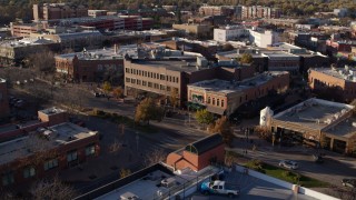 DX0001_002044 - 5.7K aerial stock footage of a view of brick office buildings and street level shops in Fort Collins, Colorado