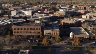 DX0001_002046 - 5.7K aerial stock footage pan across brick office buildings and street level shops in Fort Collins, Colorado