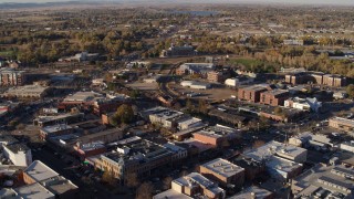 DX0001_002050 - 5.7K aerial stock footage of railroad tracks separating office buildings and warehouses in Fort Collins, Colorado