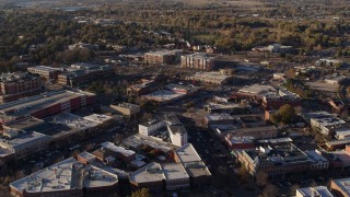 DX0001_002051 - 5.7K aerial stock footage of railroad tracks separating office buildings and warehouses in Fort Collins, Colorado