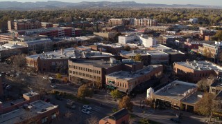 DX0001_002056 - 5.7K aerial stock footage shop with green awning and brick office building in Fort Collins, Colorado