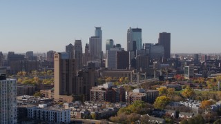 DX0001_002129 - 5.7K aerial stock footage the downtown skyline seen from residential buildings at sunrise in Downtown Minneapolis, Minnesota
