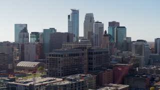 DX0001_002158 - 5.7K aerial stock footage reverse view of office building and city's skyline, Downtown Minneapolis, Minnesota