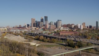 DX0001_002167 - 5.7K aerial stock footage flyby and away from the skyline of Downtown Minneapolis, Minnesota, seen from freeway