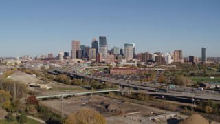 DX0001_002168 - 5.7K aerial stock footage reverse view of I-394 freeway and the skyline of Downtown Minneapolis, Minnesota