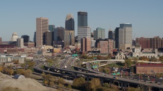 DX0001_002178 - 5.7K aerial stock footage of passing the I-394 freeway and the city skyline, Downtown Minneapolis, Minnesota