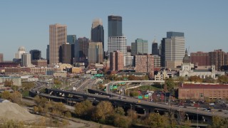 DX0001_002179 - 5.7K aerial stock footage descend by the I-394 freeway and the city skyline, Downtown Minneapolis, Minnesota