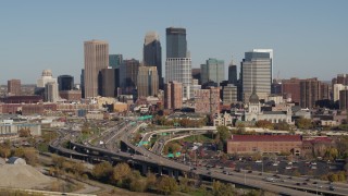 DX0001_002181 - 5.7K aerial stock footage flyby the freeway and then approach the city skyline, Downtown Minneapolis, Minnesota