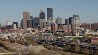 DX0001_002183 - 5.7K aerial stock footage of flying by the city skyline behind the I-394 freeway, Downtown Minneapolis, Minnesota
