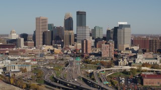 DX0001_002184 - 5.7K aerial stock footage of passing by the city skyline behind the I-394 freeway, Downtown Minneapolis, Minnesota