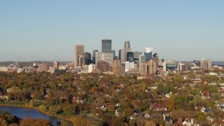 DX0001_002189 - 5.7K aerial stock footage of the city's skyline seen from lakefront homes, Downtown Minneapolis, Minnesota