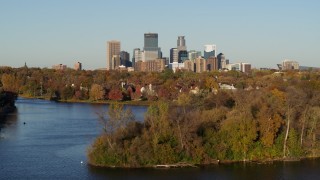 DX0001_002197 - 5.7K aerial stock footage a view of the city's skyline seen from Lake of the Isles, Downtown Minneapolis, Minnesota