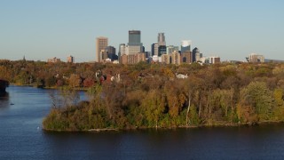 DX0001_002200 - 5.7K aerial stock footage of the downtown skyline seen from the Lake of the Isles, Downtown Minneapolis, Minnesota