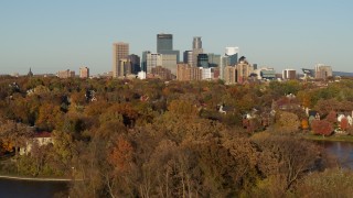 DX0001_002206 - 5.7K aerial stock footage of reverse view of the city skyline, seen from Lake of the Isles, Downtown Minneapolis, Minnesota