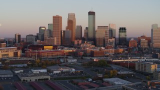 DX0001_002234 - 5.7K aerial stock footage stationary view of the city's skyline at sunset, Downtown Minneapolis, Minnesota