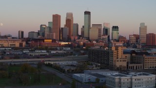 DX0001_002239 - 5.7K aerial stock footage the city's skyline and the moon at sunset, seen from marketplace, Downtown Minneapolis, Minnesota