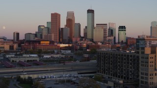 DX0001_002240 - 5.7K aerial stock footage flyby city's skyline at sunset, seen from marketplace, Downtown Minneapolis, Minnesota