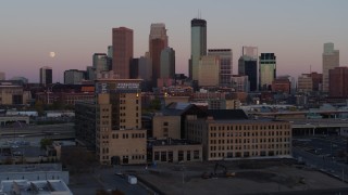 DX0001_002244 - 5.7K aerial stock footage the city's skyline at sunset seen from marketplace, Downtown Minneapolis, Minnesota
