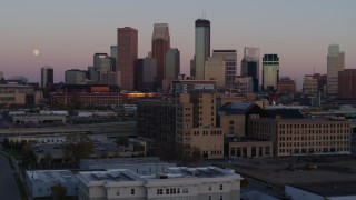 DX0001_002245 - 5.7K aerial stock footage the city's downtown skyline at sunset seen from marketplace, Downtown Minneapolis, Minnesota
