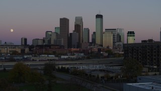 DX0001_002246 - 5.7K aerial stock footage ascend from park for view of the city's downtown skyline at twilight, Downtown Minneapolis, Minnesota