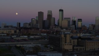 DX0001_002253 - 5.7K aerial stock footage passing by the city's downtown skyline at twilight, seen from market, Downtown Minneapolis, Minnesota