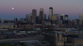 DX0001_002254 - 5.7K aerial stock footage descend with market near the city's downtown skyline at twilight, Downtown Minneapolis, Minnesota