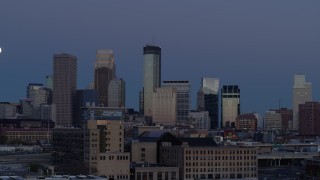 DX0001_002266 - 5.7K aerial stock footage flyby the city's skyline with the moon in the sky at twilight, reveal market, Downtown Minneapolis, Minnesota