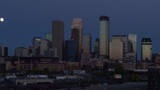 DX0001_002271 - 5.7K aerial stock footage of skyscrapers in city skyline at twilight seen during ascent, Downtown Minneapolis, Minnesota