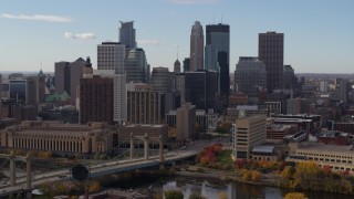 DX0001_002381 - 5.7K aerial stock footage fly near bridge and towering skyscrapers of the city skyline, Downtown Minneapolis, Minnesota