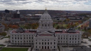DX0001_002444 - 5.7K aerial stock footage orbit state capitol building, with city skyline and cathedral in background, Saint Paul, Minnesota