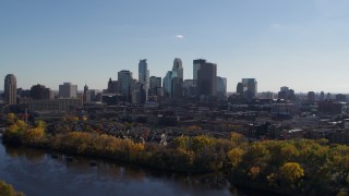 DX0001_002453 - 5.7K aerial stock footage reverse view of city skyline, reveal Mississippi River, Downtown Minneapolis, Minnesota