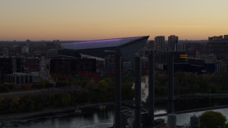DX0001_002546 - 5.7K aerial stock footage flyby power plant with view of US Bank Stadium across the river at sunset, Downtown Minneapolis, Minnesota