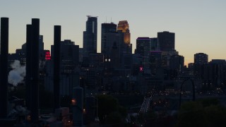 DX0001_002563 - 5.7K aerial stock footage slow pass of the city skyline at twilight, reveal the power plant, Downtown Minneapolis, Minnesota