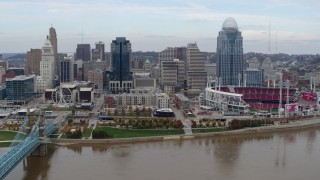 DX0001_002597 - 5.7K aerial stock footage slowly fly away from city skyline and baseball stadium by Ohio River, Downtown Cincinnati, Ohio