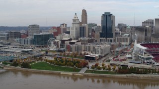 DX0001_002607 - 5.7K aerial stock footage reverse view of the city's skyline seen from the river, Downtown Cincinnati, Ohio