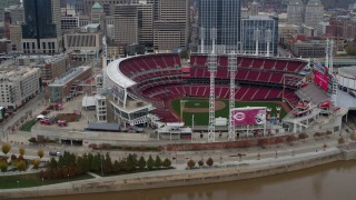 DX0001_002609 - 5.7K stock footage aerial video ascend from Ohio River to approach the baseball stadium, Downtown Cincinnati, Ohio