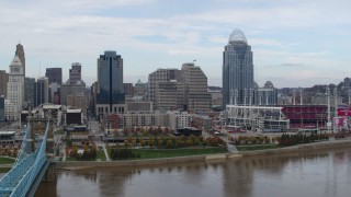 DX0001_002615 - 5.7K aerial stock footage passing by riverfront baseball stadium and skyline, seen from river, Downtown Cincinnati, Ohio