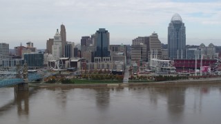 DX0001_002618 - 5.7K aerial stock footage passing a riverfront baseball stadium and skyline, Downtown Cincinnati, Ohio