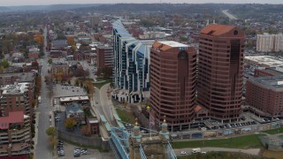 DX0001_002622 - 5.7K aerial stock footage flying by modern condominium complex and two riverfront office buildings in Covington, Kentucky