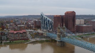 DX0001_002627 - 5.7K aerial stock footage of passing a condominium complex, two riverfront office buildings and bridge in Covington, Kentucky