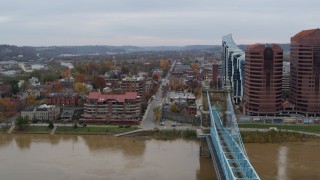 DX0001_002628 - 5.7K aerial stock footage of flying by a bridge for view of two riverfront office buildings in Covington, Kentucky