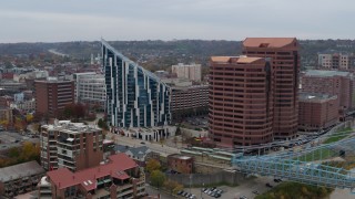 DX0001_002630 - 5.7K aerial stock footage of flying by a condo complex and two riverfront office buildings in Covington, Kentucky