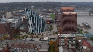 DX0001_002631 - 5.7K aerial stock footage of flying away from a condo complex and two riverfront office buildings in Covington, Kentucky